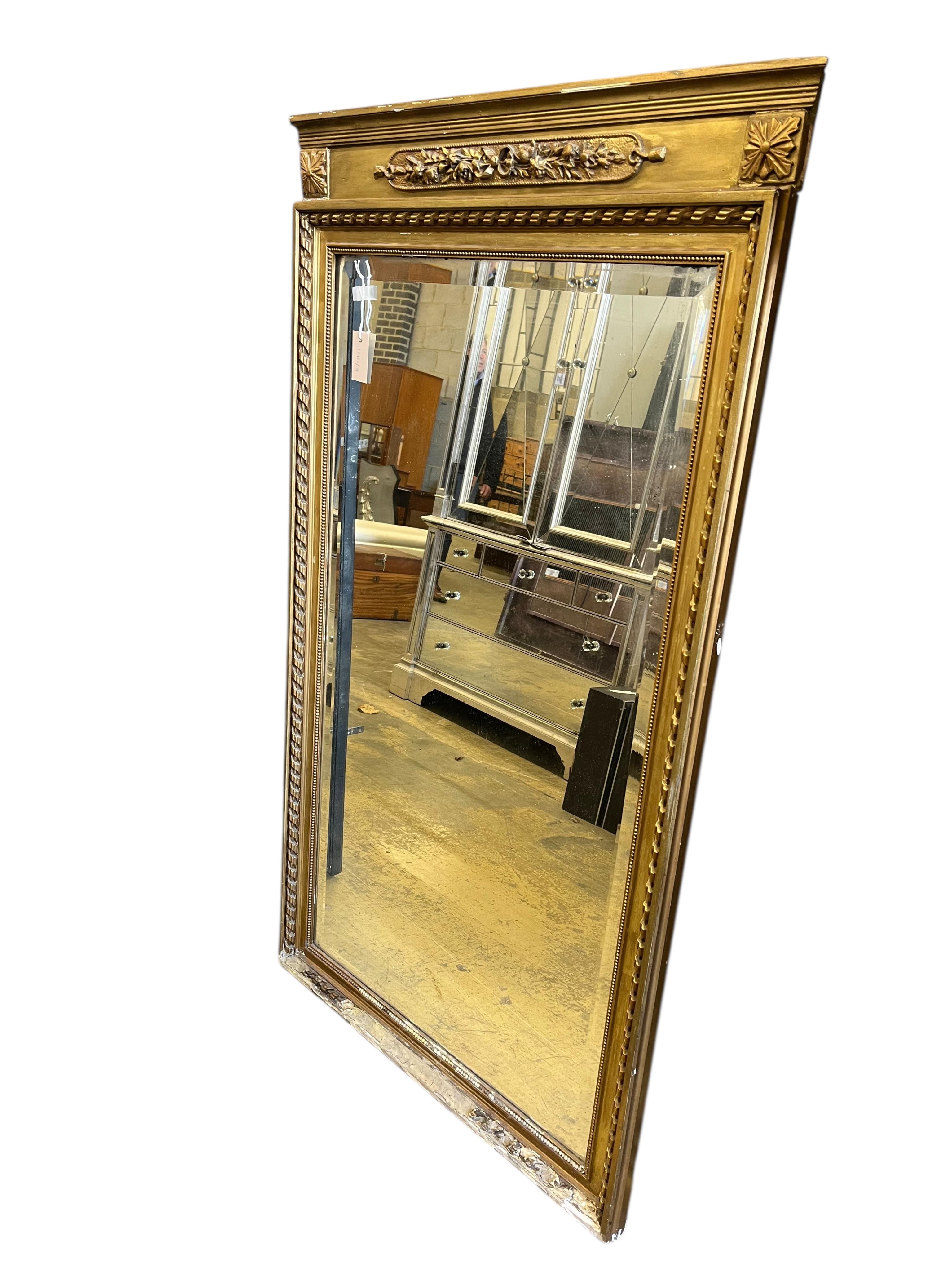 A late 19th century giltwood and composition pier glass, width 83cm, height 145cm